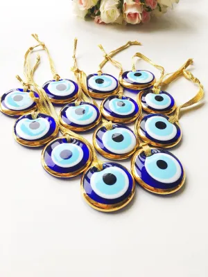 Gold trimmed glass evil eye beads with gold ropes